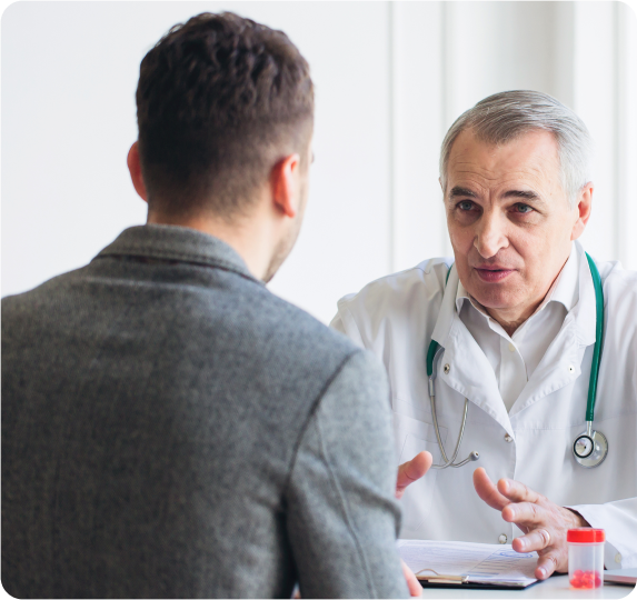 A doctor consulting a patient about the vasectomy procedure